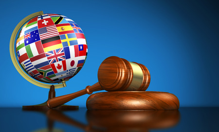 40855224 - international law systems, justice, human rights and global business education concept with world flags on a school globe and a gavel on a desk on blue background.