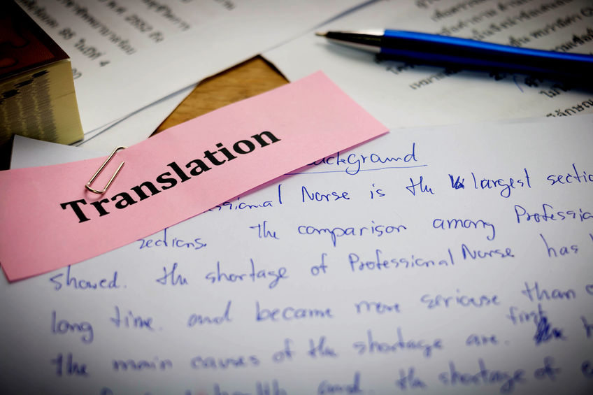 handwriting blue english words on white paper represent translating to English language